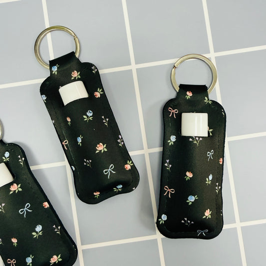 Chapstick Holder Keychain, Black Ditsy Floral and Bows Pattern